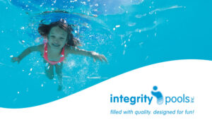 girl underwater in swimming pool for integrity pools branding