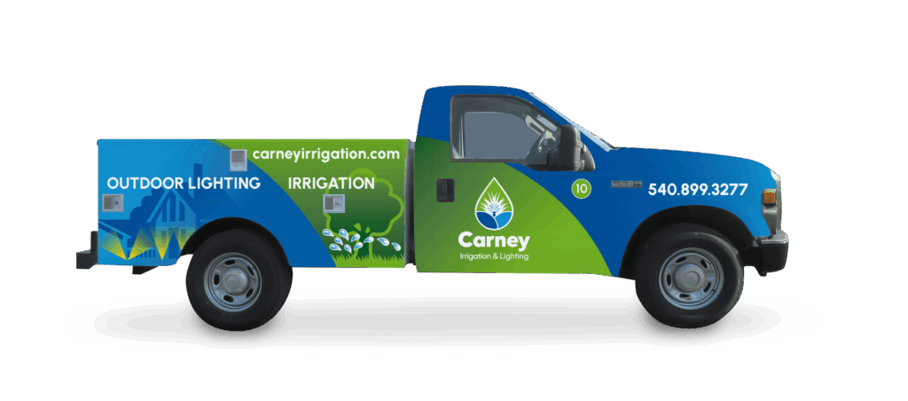 Branded service truck featuring Carney Irrigation & Lighting’s contact info and outdoor lighting graphics