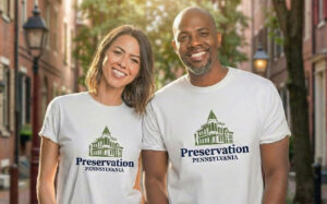 two people in branded t-shirts with the Preservation Pennsylvania logo design