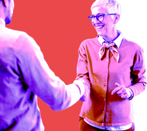 Two people shaking hands in a friendly greeting